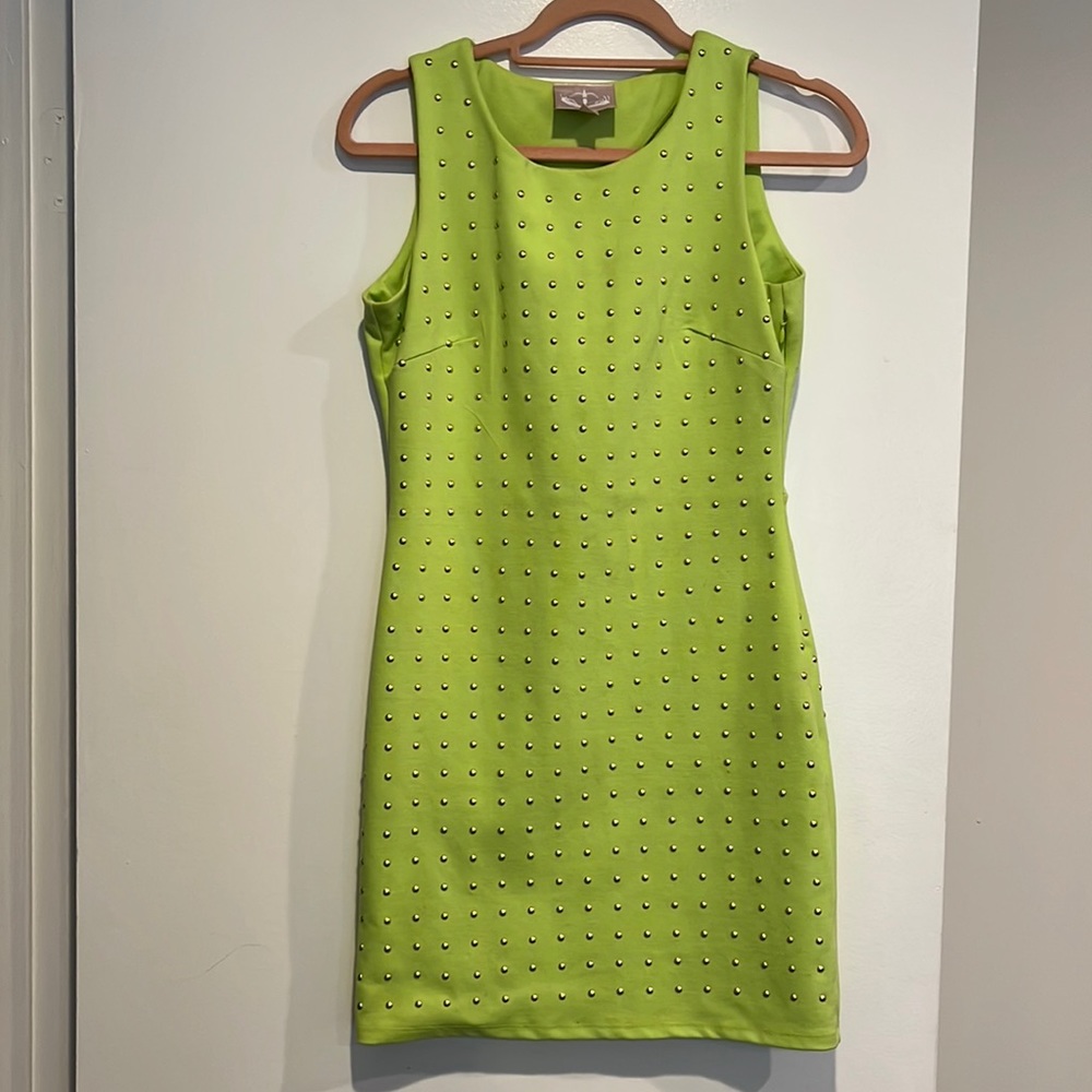 Chartreuse mini dress with gold bead detail and peekaboo back detail.
